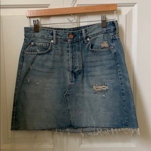 Light washed distressed denim skirt